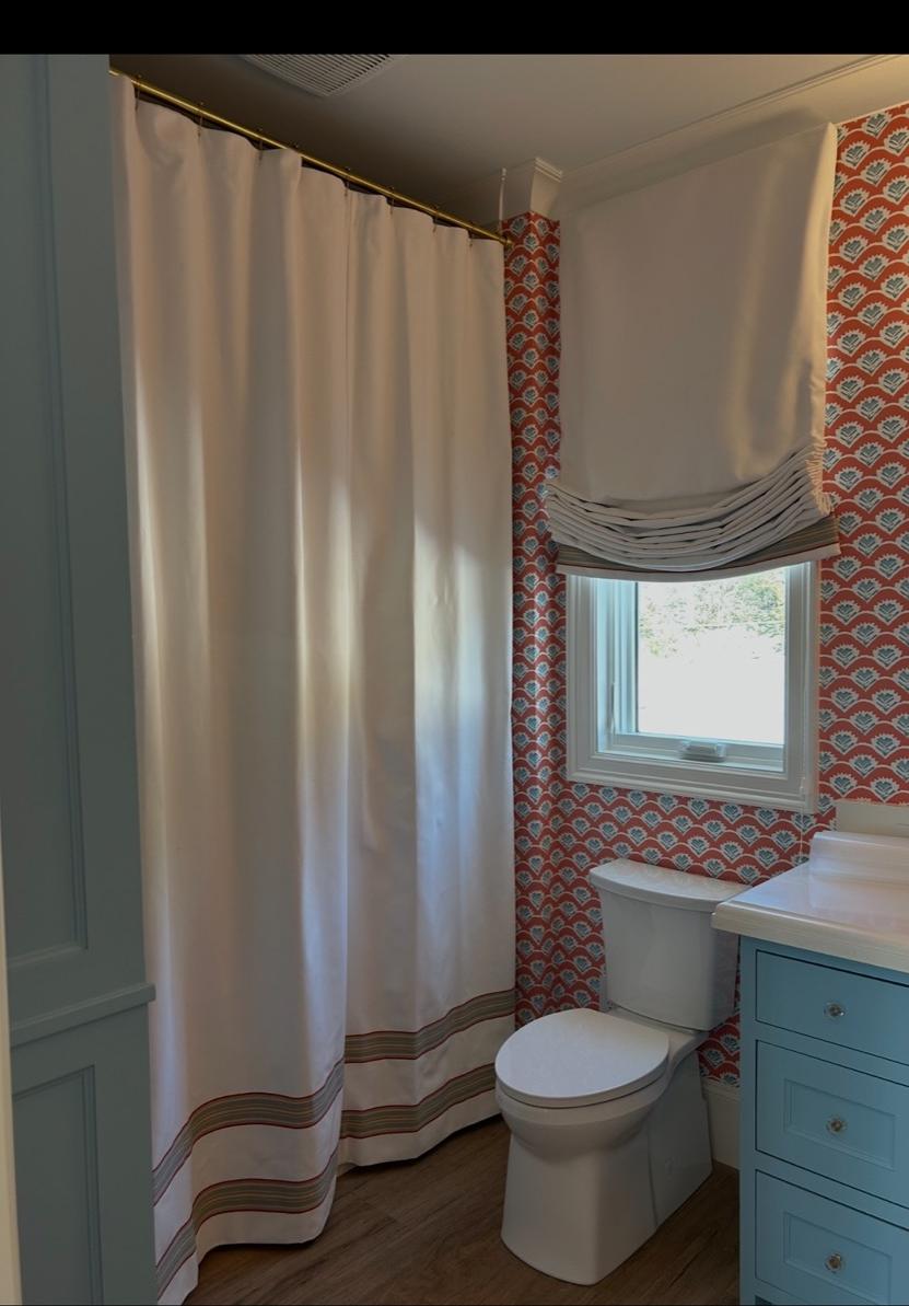 Custom shower curtain and roman shade in a client bathroom