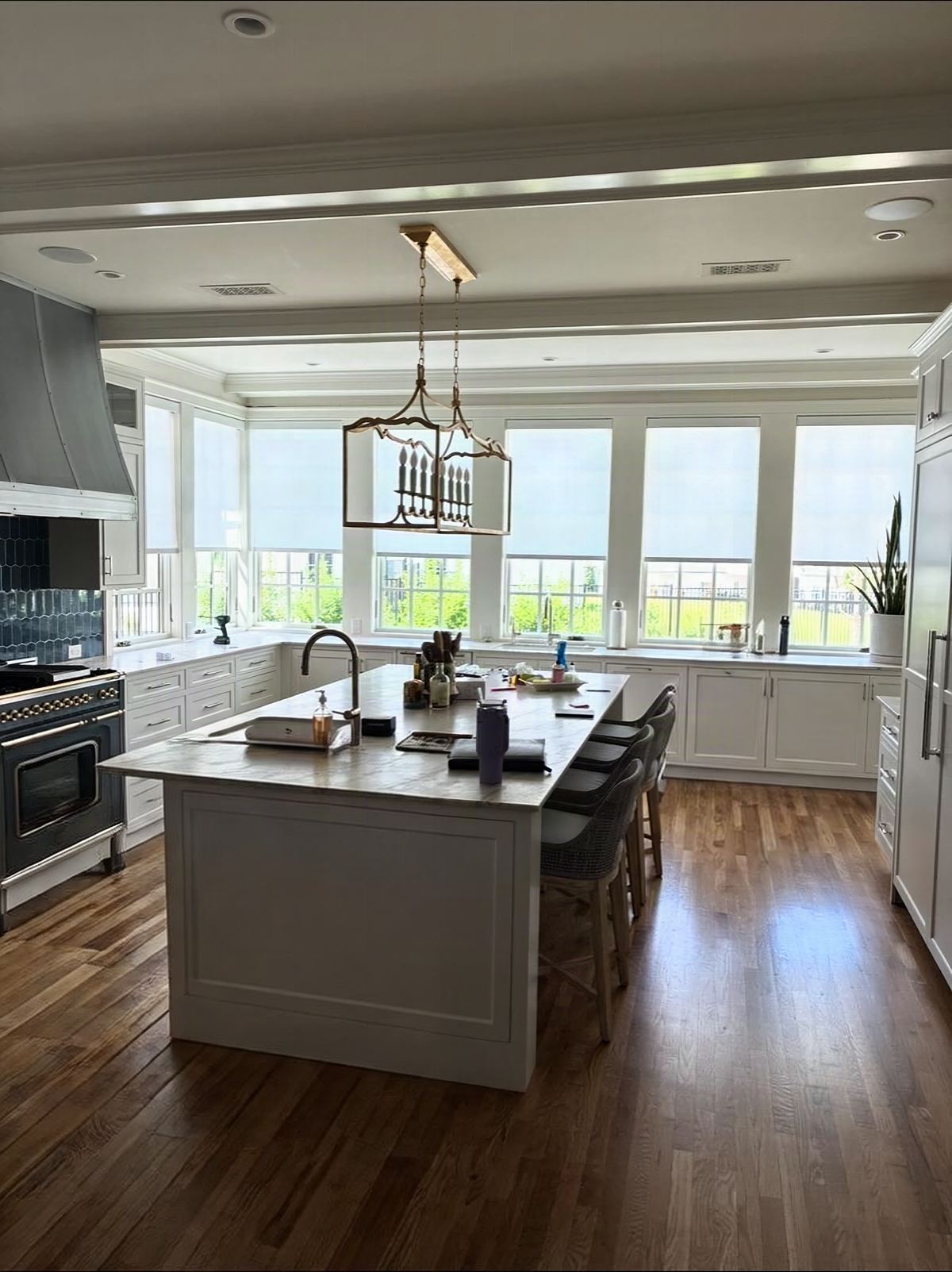Hunter Douglas roller shades across a client kitchen