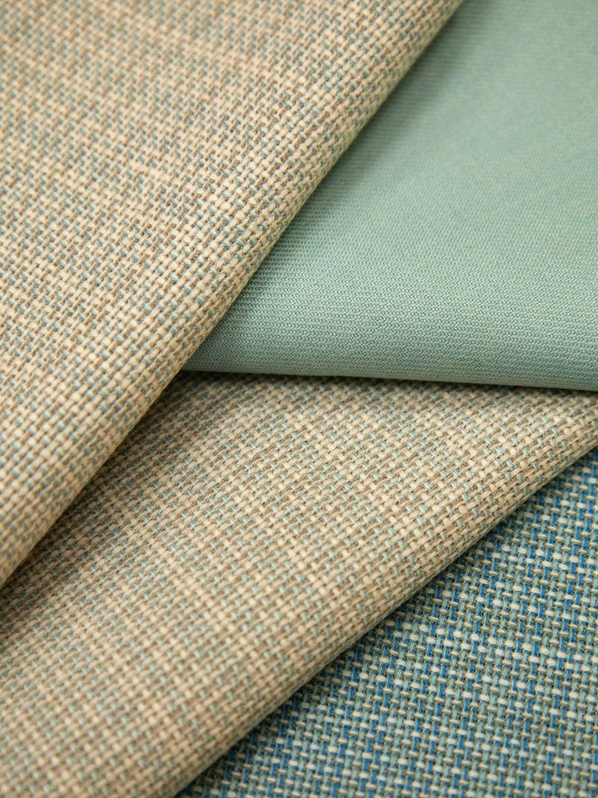 Neutral fabric swatches laid out together